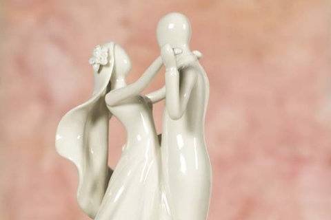 This Stylized Bride and Groom is a contemporary twist on a traditional element. Picture this, a stylized couple dancing topping your wedding cake. This cake top will add a unique elegant touch to your wedding and a memento for years to come.
SKU: 707527W
$29.95
http://www.weddingcollectibles.com/Stylized-Bride-and-Groom-Figurine-p-153.html