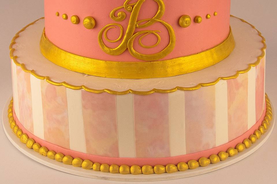 Pink themed cake with gold accents