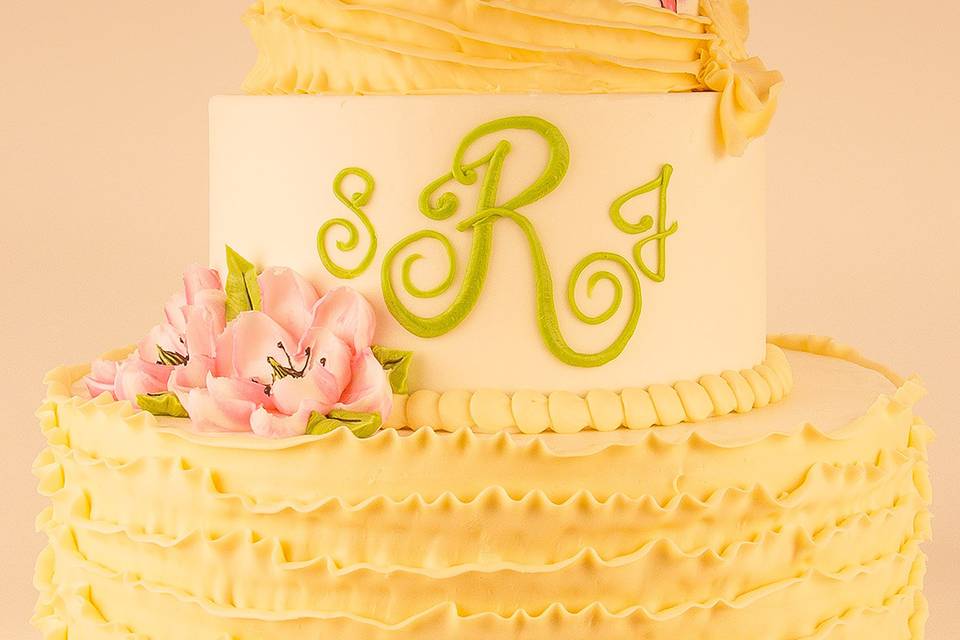 Light yellow textured cake with hand painted flowers