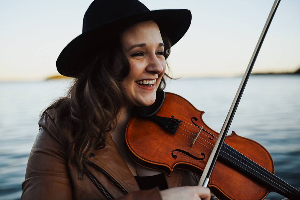 Morgan smiles with violin