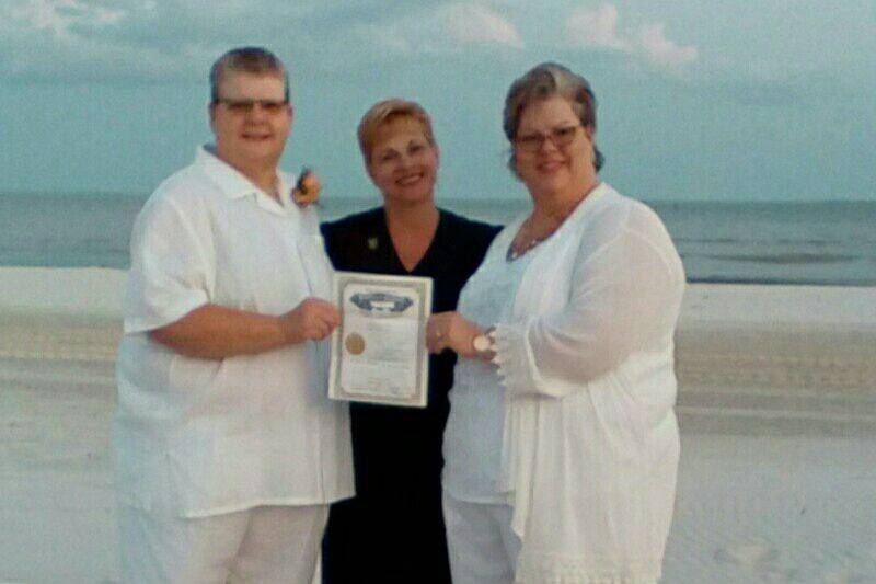 Couple with the officiant