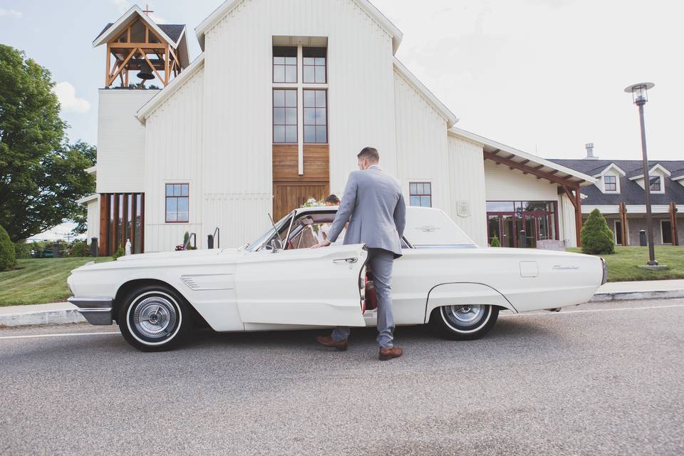 Grand exit in a classic car