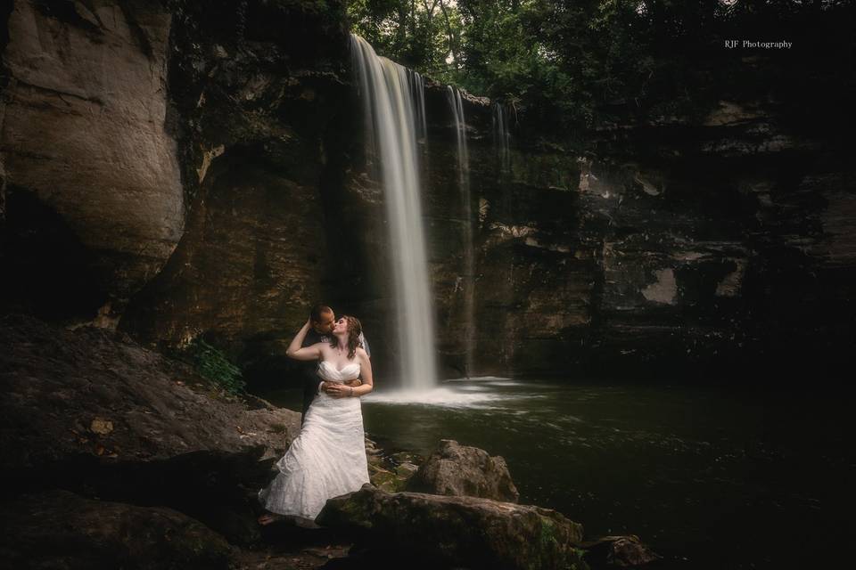 Bride and Groom near waterfall