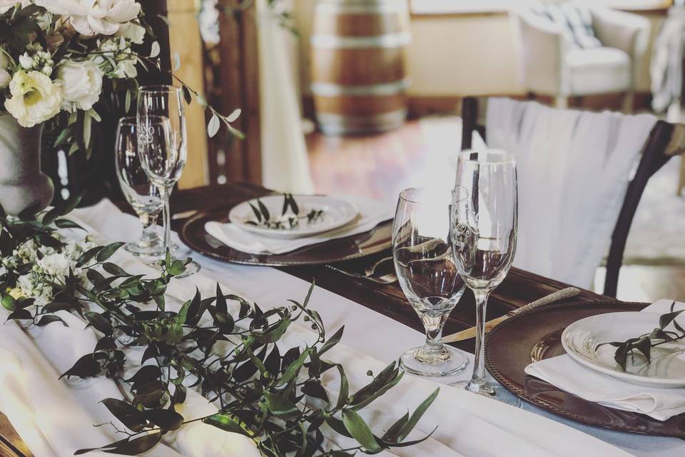 Table runner with dark green leaves