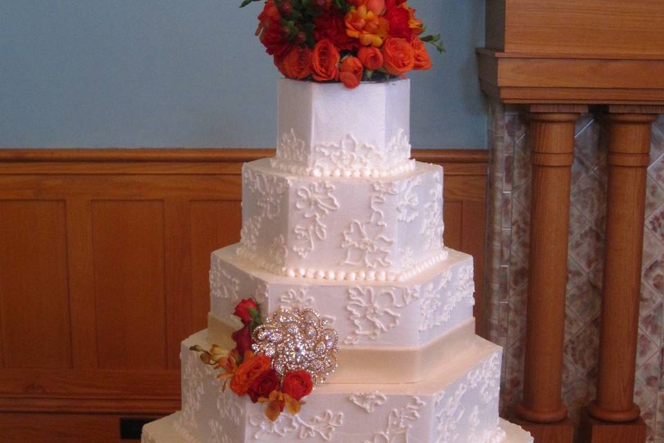 Angled cake with flower topper