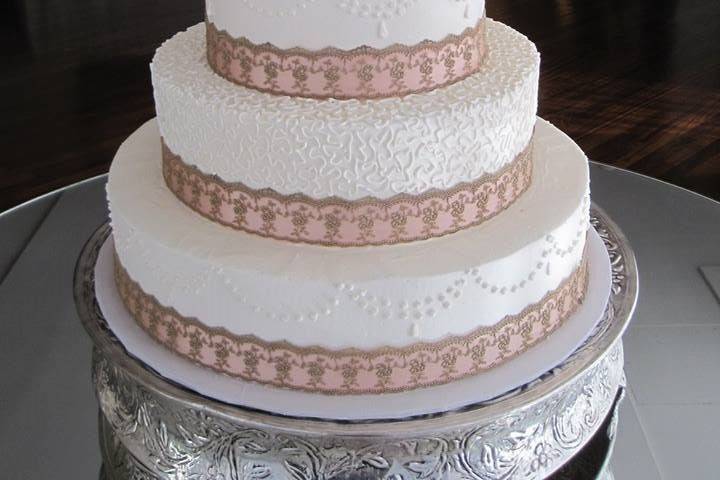 White cake with ribbon decor