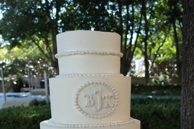 White cake with embossed logo