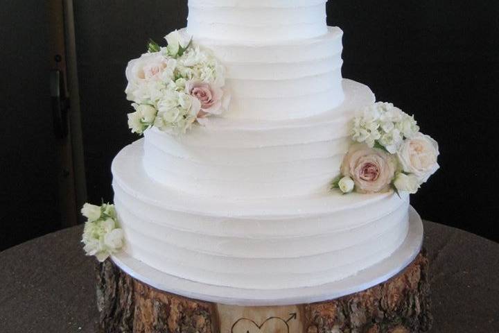 White cake with white roses