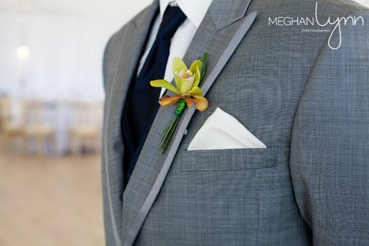 Simple boutonniere crafted from two orchids.