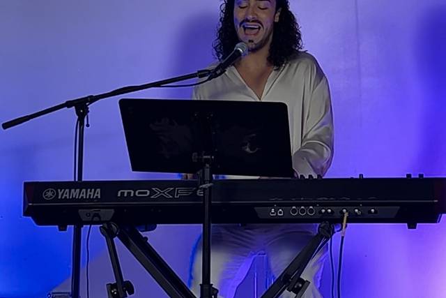 Playing piano and singing