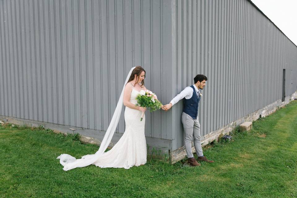 Couple walks through grass