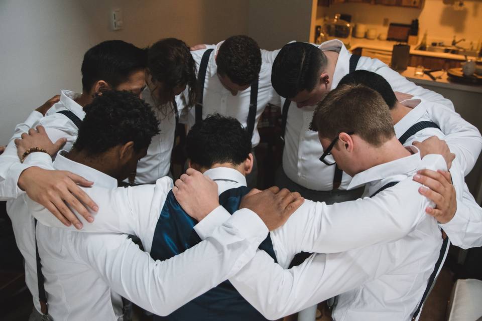 Groomsmen huddle up