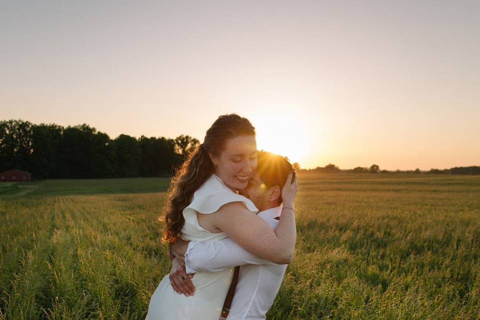 Couple embraces at sunset