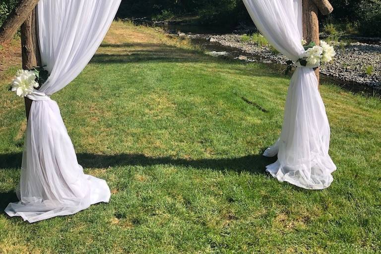 Wedding arbor with white florals