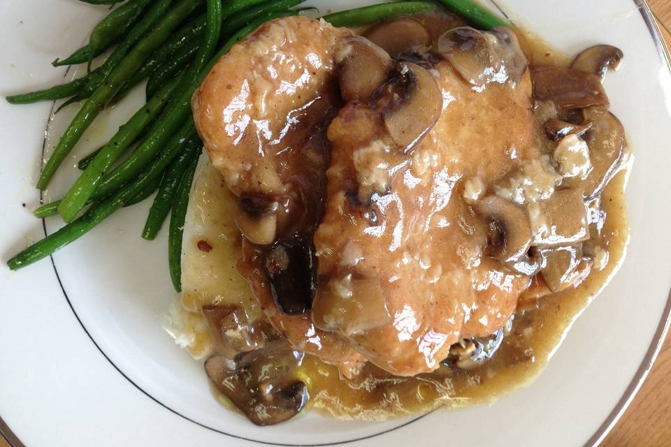 Chicken Marsala served over mashed potatoes and sauteed fresh French green beans