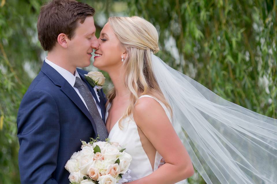 Happiest Bride and Groom at Delaware Park, Buffalo New York. Portrait taken by Lovely Day Photo