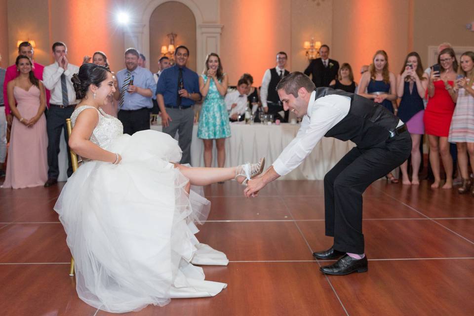 Garter Removal Ceremony at Columns Banquet Facility, in Buffalo New York. Portrait by Lovely Day Photo