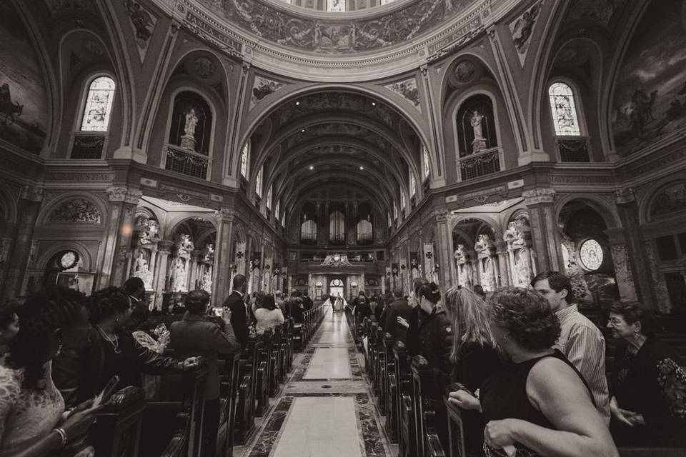 Bride coming down the aisle at OLV. Bascilica. by Lovely Day Photo