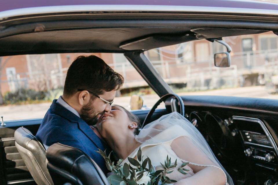 Kissing in a Vintage Car