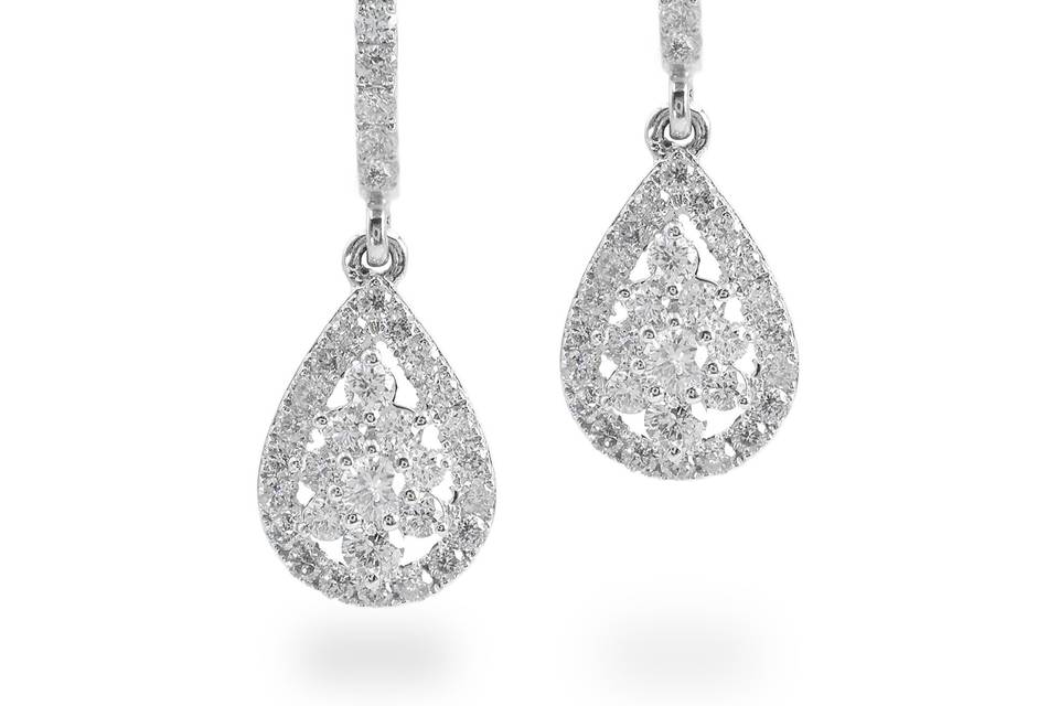 Orana Diamonds cascade down these lustrous drop earrings. Diamonds-filled teardrop dangles beautifully encased in pave diamonds. Diamond : 1.0 Carats Approx.Cut : Round BrilliantsColor : E-FClarity : VS - SIGold Karat : 14kt.Gold Color : White GoldGold Weight : 3.4g
