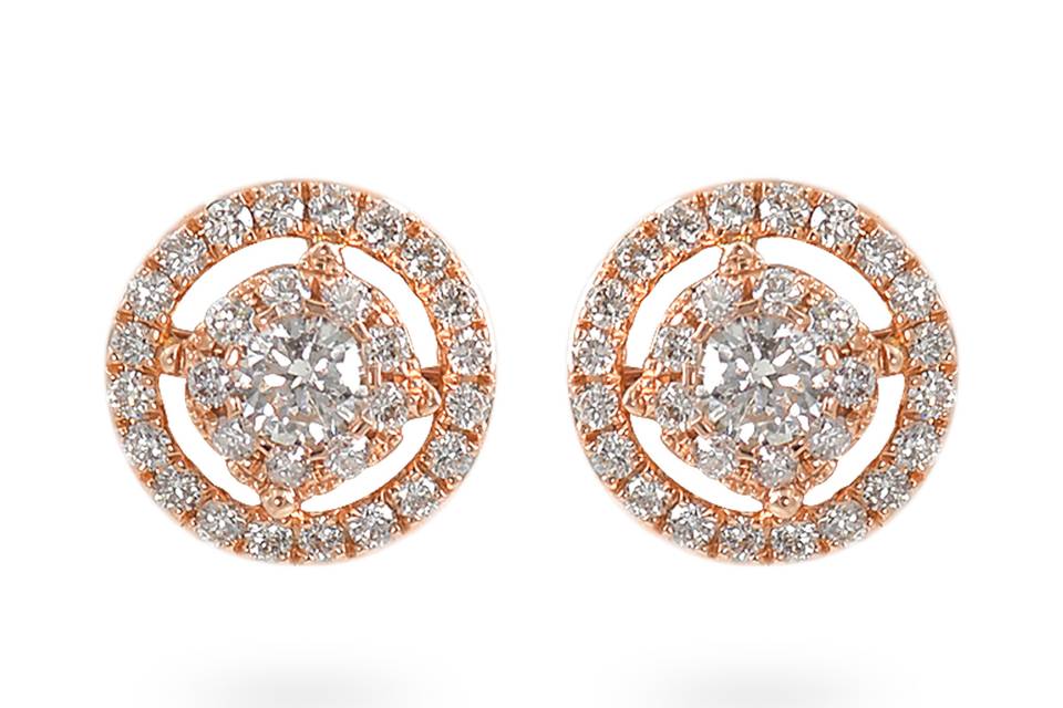 Rosy EleganceA halo of accent diamonds surrounds a dazzling circle center of round diamond and round accent diamonds. Diamond : 0.50 Carats Approx.Cut: Round BrilliantsColor: E-FClarity: VS - SIGold Karat: 14kt.Gold Color: Rose GoldGold Weight : 2.6g