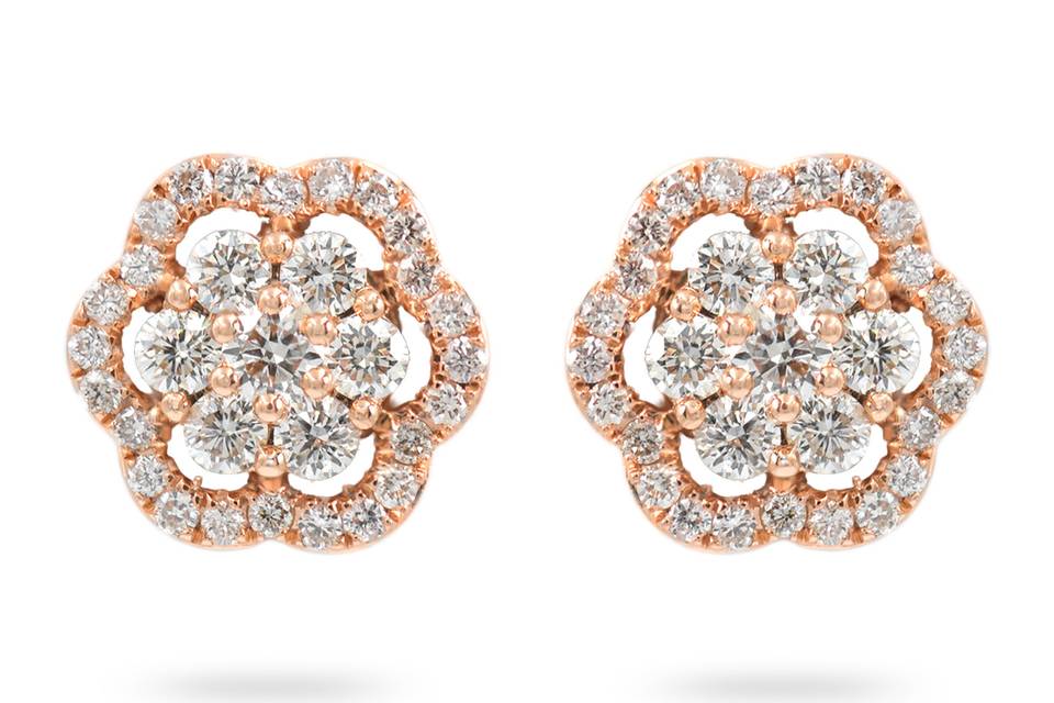 DaffodilsRose gold floral diamond studs with a floral halo. Diamond : 0.54 Carats Approx.Cut: Round BrilliantsColor: F-GClarity: VS - SIGold Karat: 14kt.Gold Color: Rose GoldGold Weight : 2.4g
