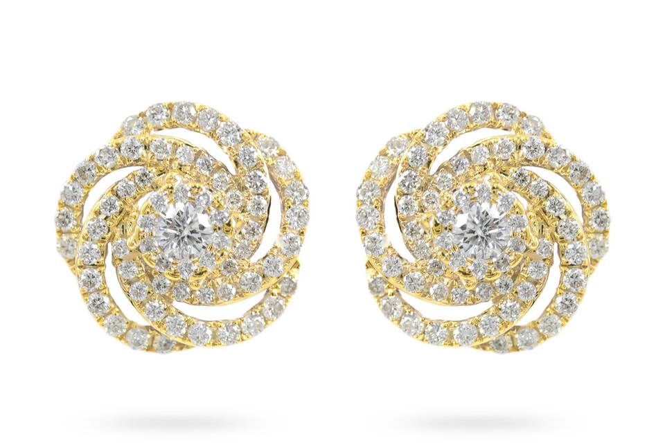 Golden CarnationsRadiant round diamonds at the center surrounded by swirling lines reminiscent of rose petals. Diamond :0.85 Carats Approx.Cut: Round BrilliantsColor:E-FClarity: VSGold karat: 14kt.Gold Color: Yellow GoldGold Weight : 4.1g