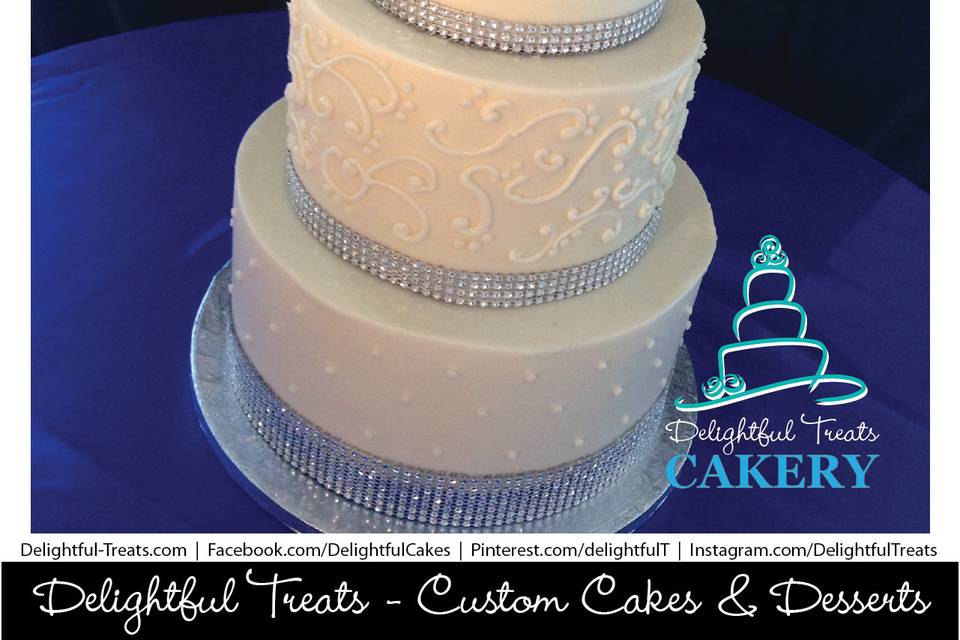 3 Tier Custom Buttercream Wedding Cake with Swiss Dots, Scroll Piping & Rhinestone Ribbon by Delightful Treats Cakery