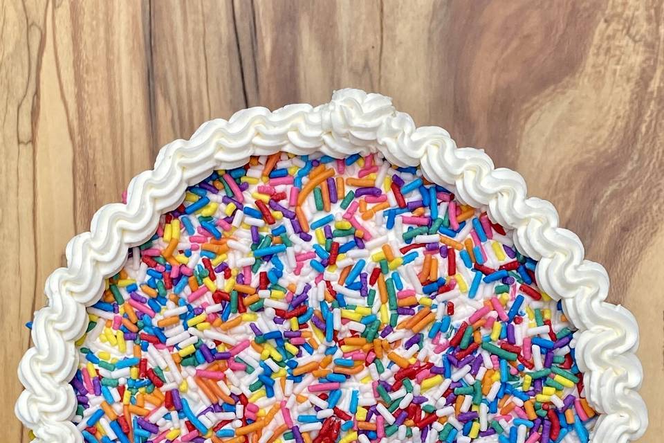 Sprinkle pinata rainbow cake