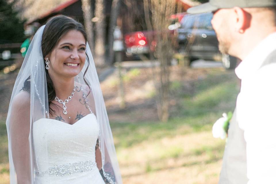 Bride smiing at Groom