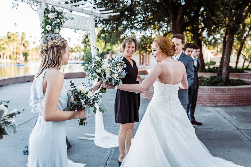 Paige hands off her bouquet