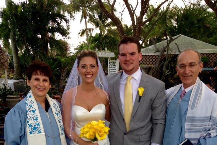 Newlyweds with the officiants