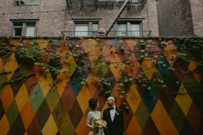 Newlyweds by the mural