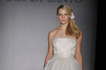 Elodie:
Strapless off white Silk Tulle ball gown with comet beading throughout skirt. Features a natural waist cut accented with heavier beading.