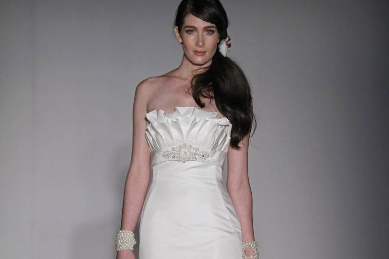Lucienne:
Strapless off white Doppia Faccia mermaid gown with ruffle detail at bust and appliqué at empire