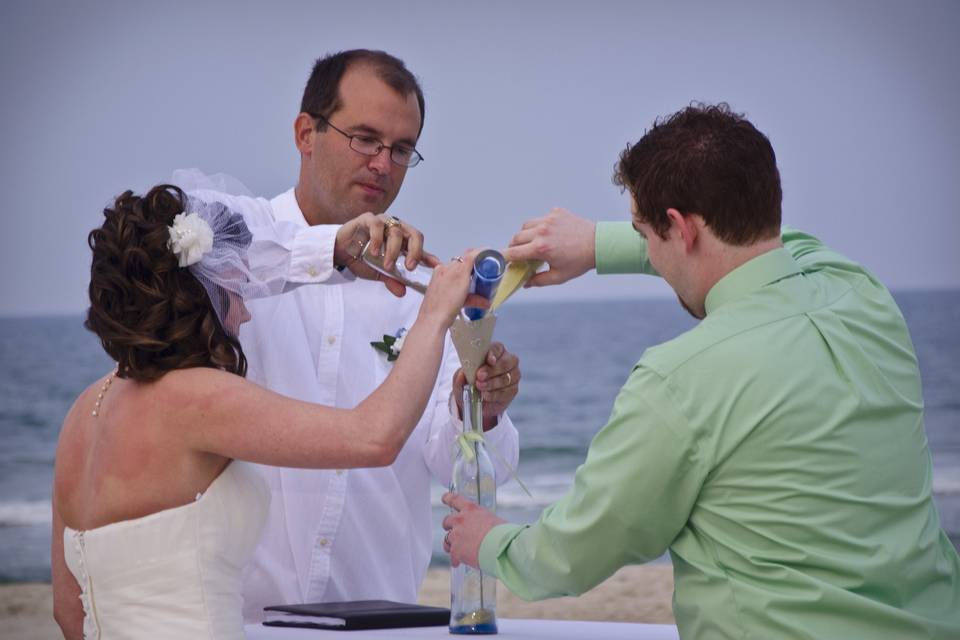 A sand ceremony is a nice addition to any wedding on the beach!  Photo by Bill Powers.