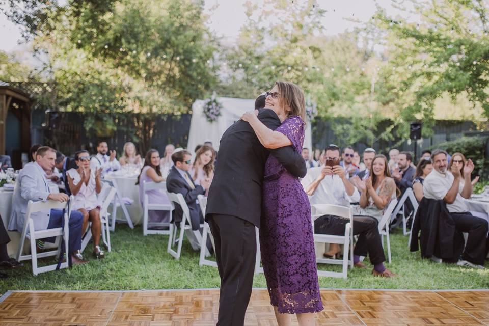 Groom and mother embracing