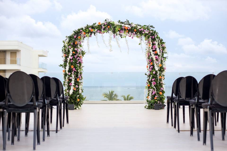 Floral arch by the ocean