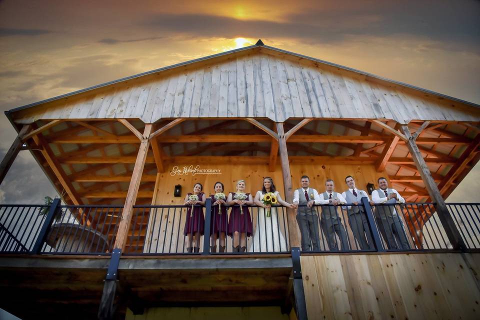 The couple with the bridesmaids and groomsmen