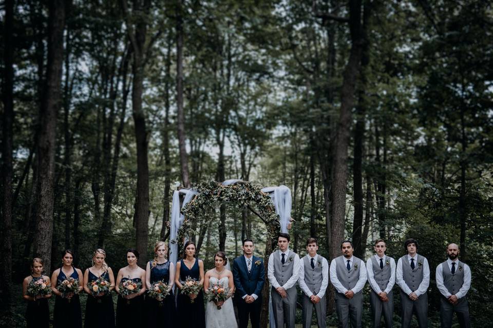 The couple with the bridesmaids and groomsmen