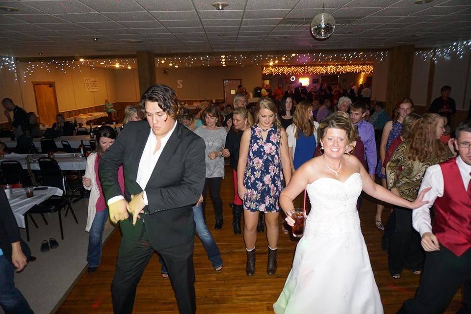 The couple dancing with their guests