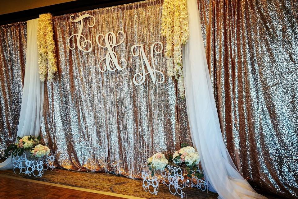 Blush sequin drape with added flowers and drape overlay
