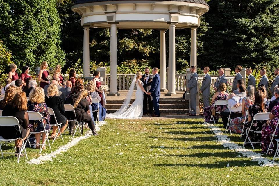 Rose petals line the aisle