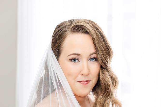 Bride playing with veil