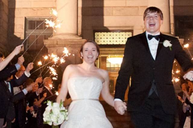 Couple standing on grand staircase outside