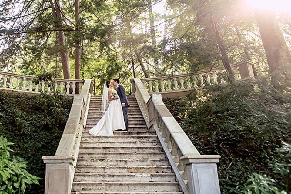 Couple standing on grand staircase outside