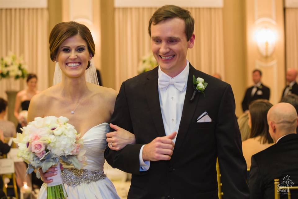All smiles during wedding recessional