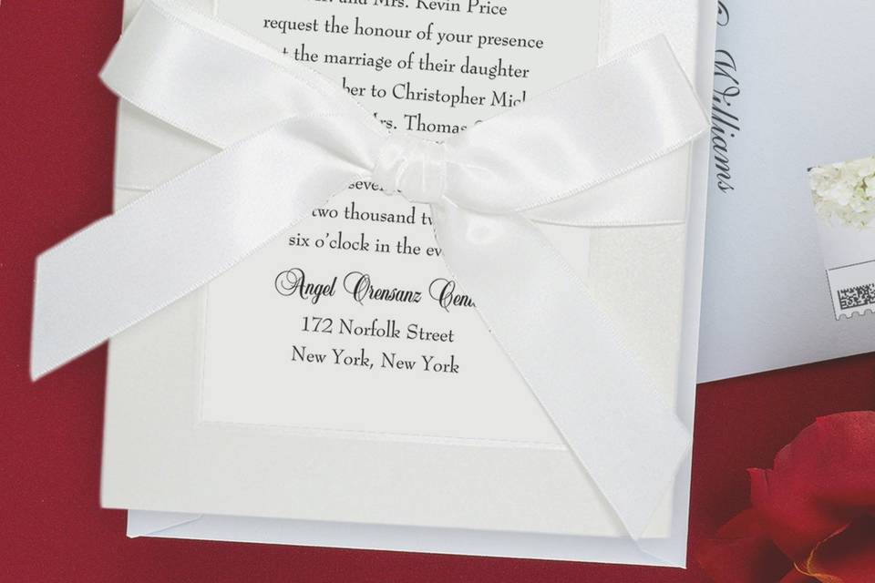This stylish, square shaped contemporary wedding invitation features two layers of luxurious card stock with metallic and shimmer paper options as well. Your text is imprinted with raised ink printing. Card colors, paper types and envelopes are all changeable, so feel free to mix and match for your particular taste.Dimensions: 6.25