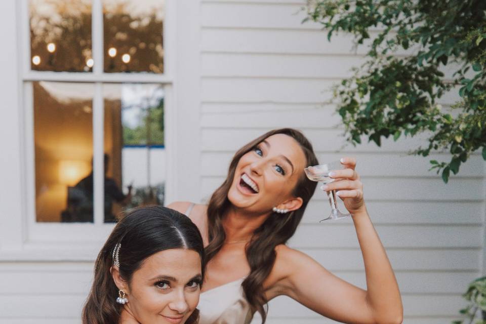 Bride and maid of honor celebr