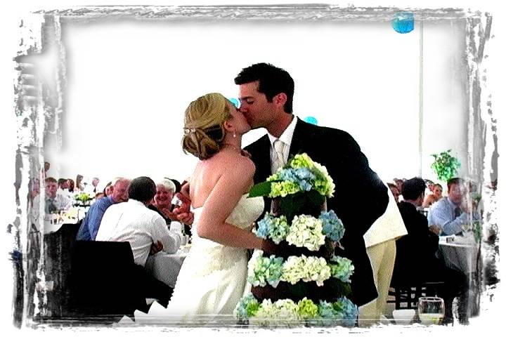 Couple kissing by cake